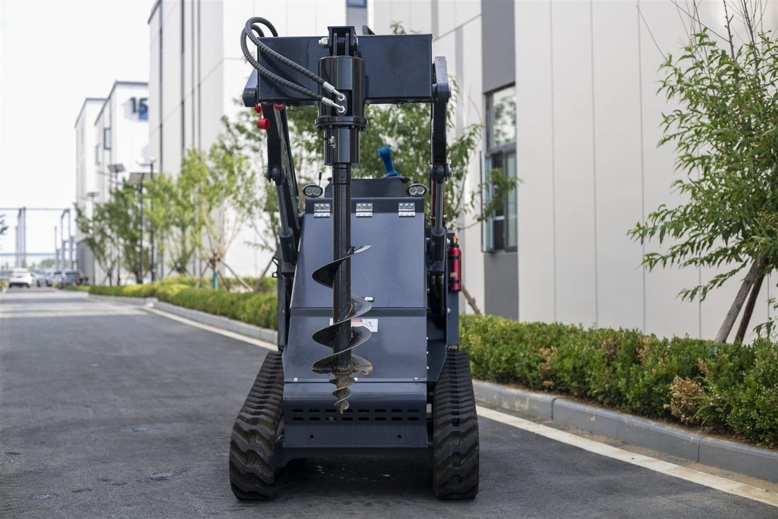 Auger drill attachment for skid steer loader