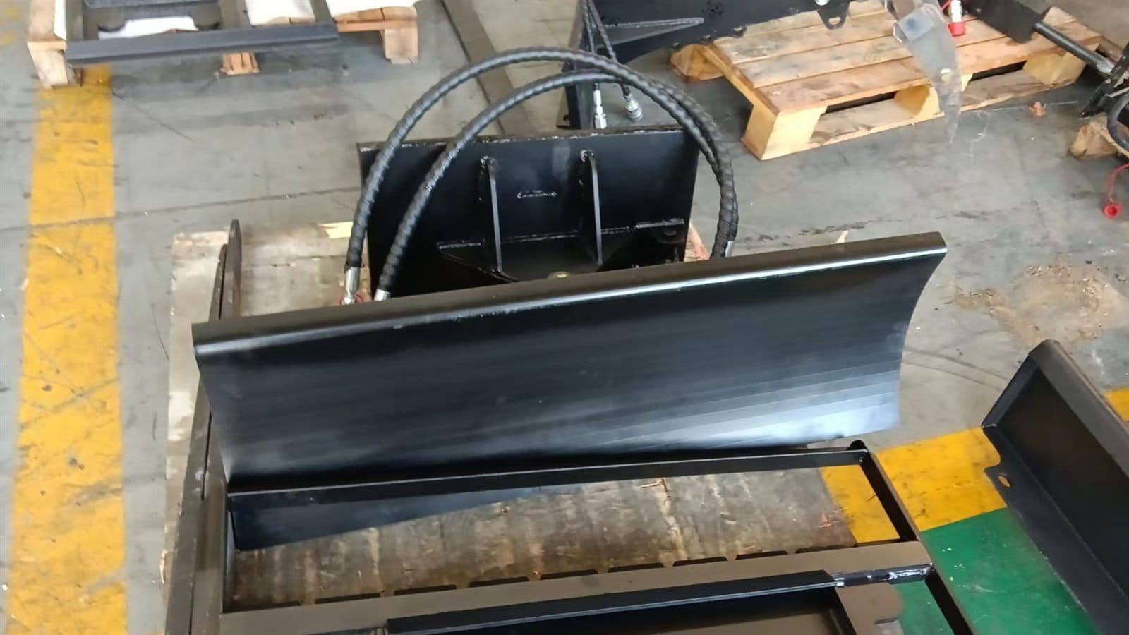 Dozer blade attachment for skid steer loader