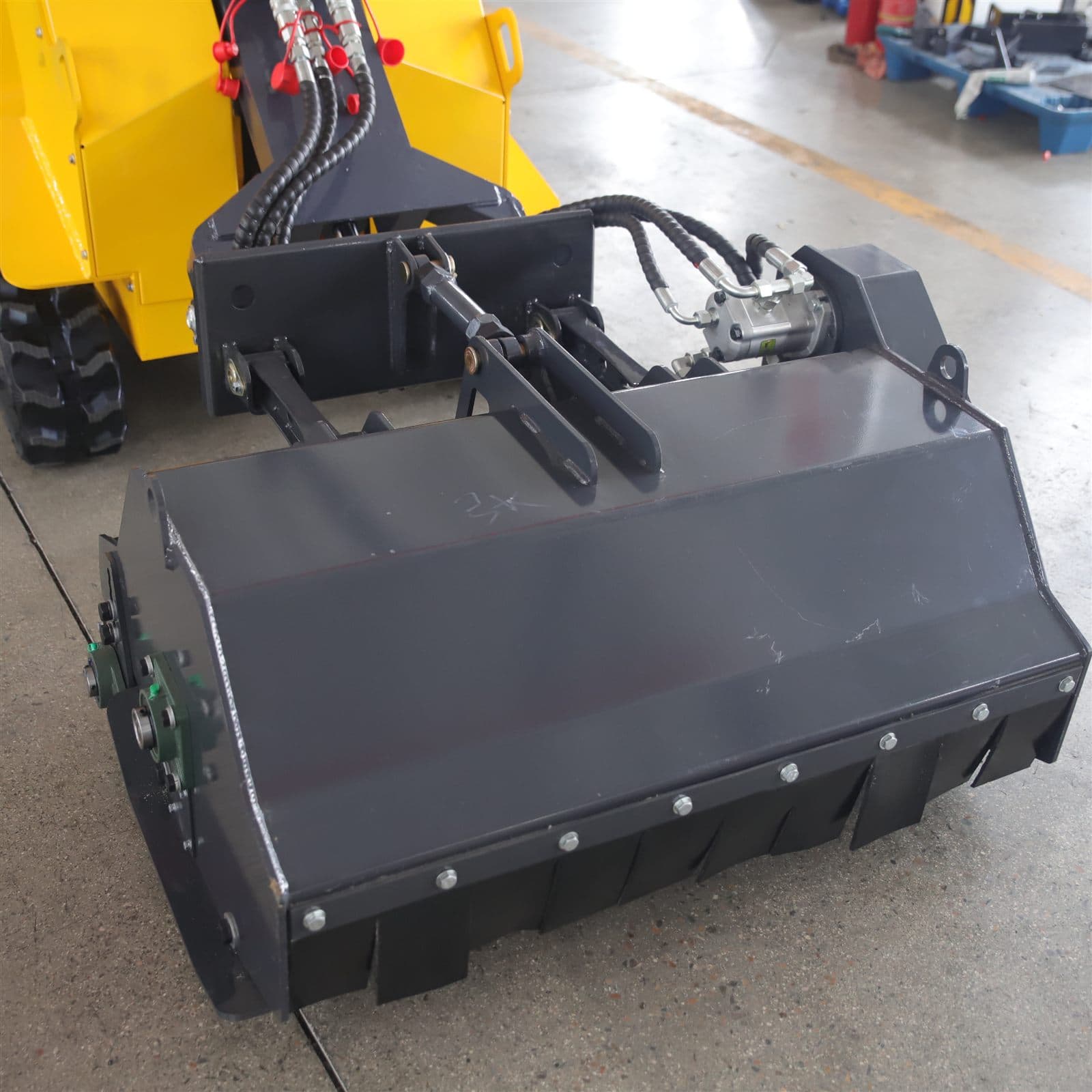 Flail mower attachment for skid steer loader
