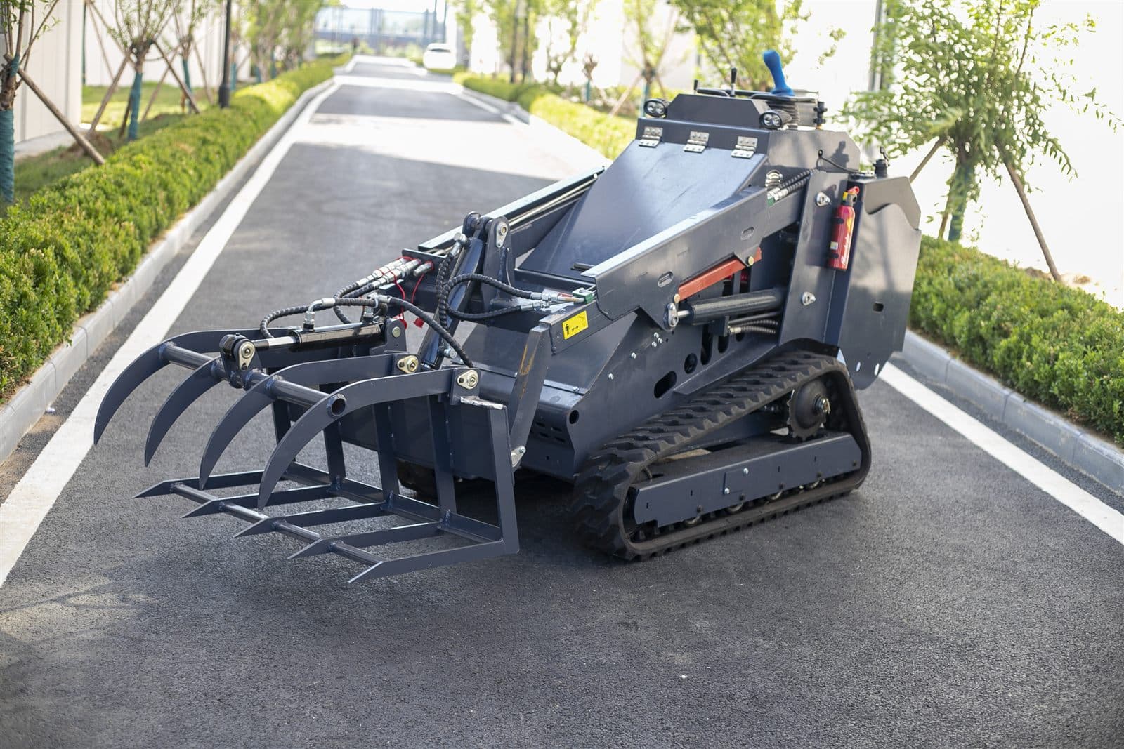 Log grapple fork attachment for skid steer loader