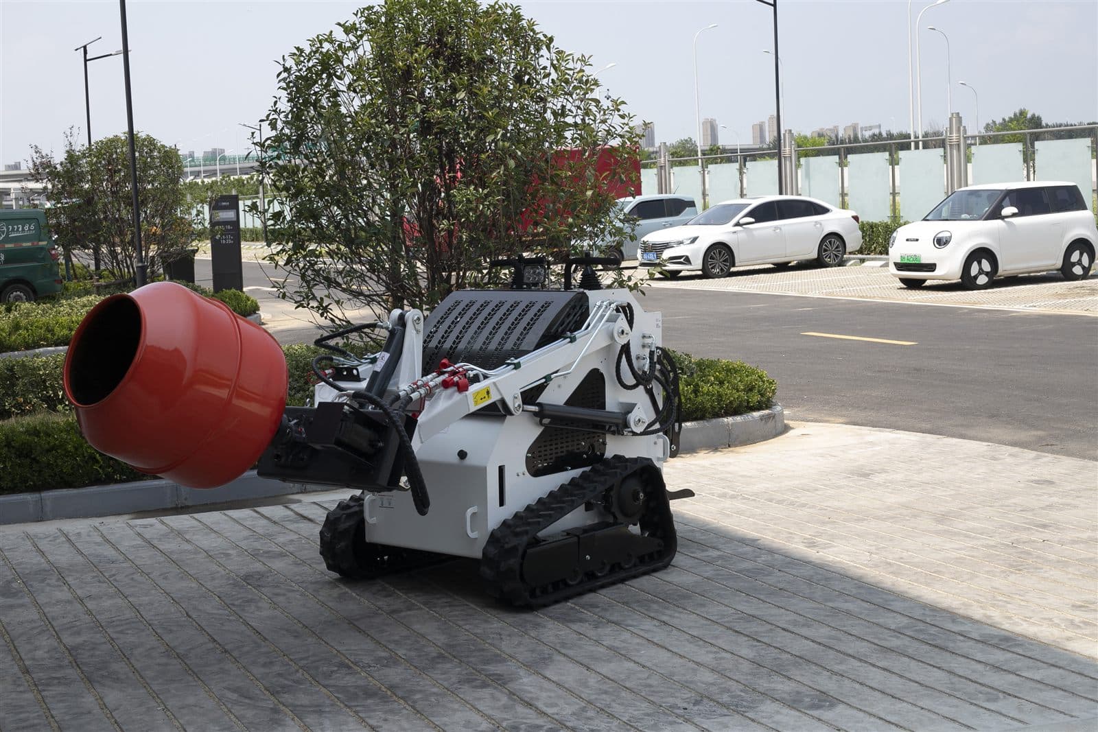 Mixing drum attachment for skid steer loader