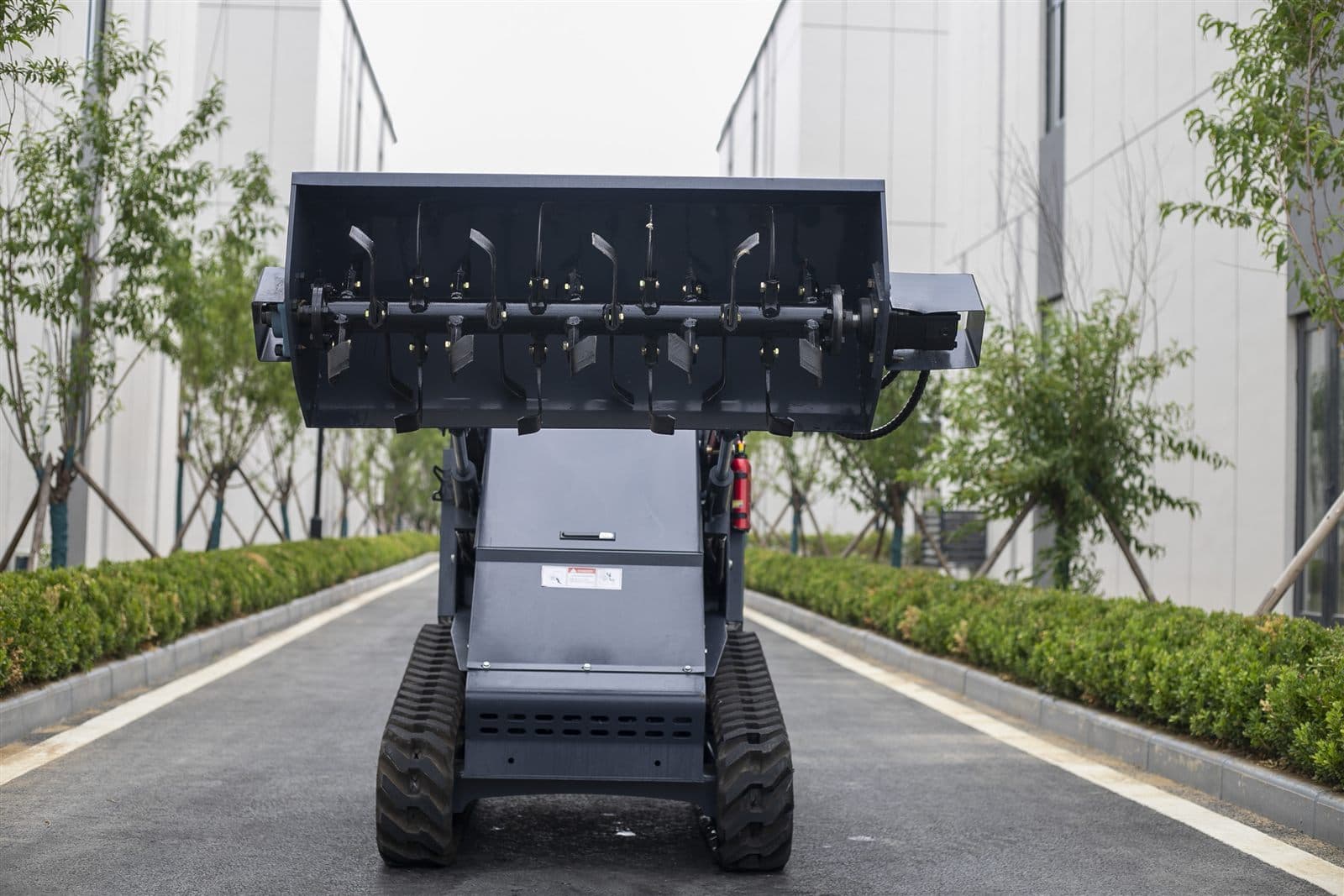 Rotary tiller attachment for skid steer loader