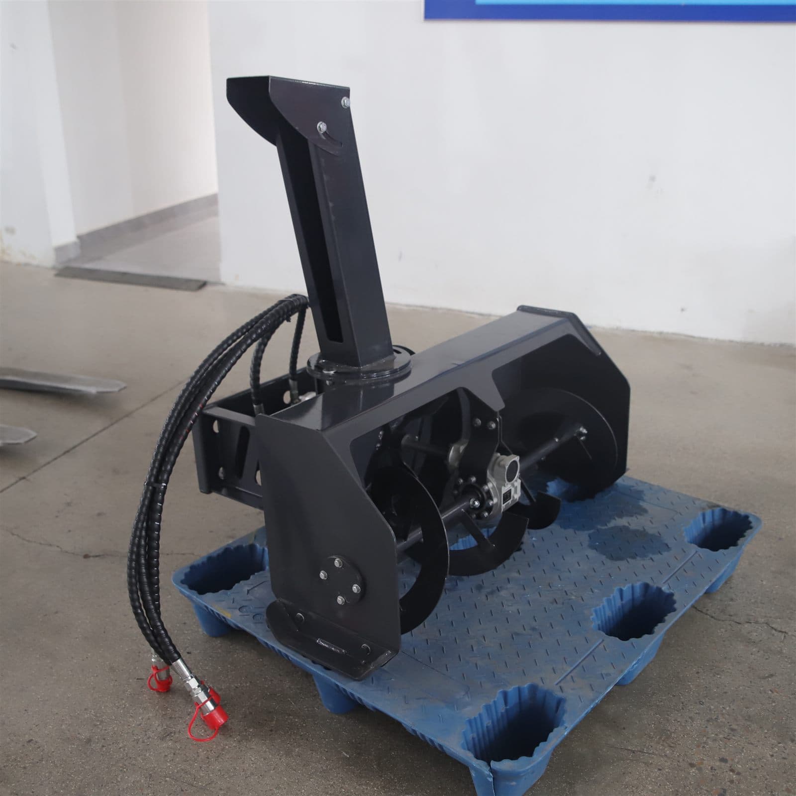 Snow blower attachment for skid steer loader