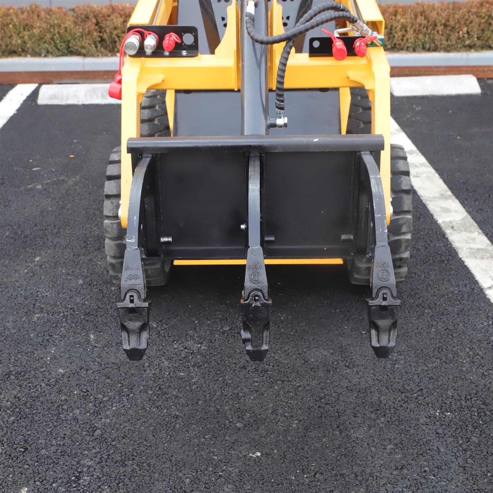Soil ripper attachment for skid steer loader