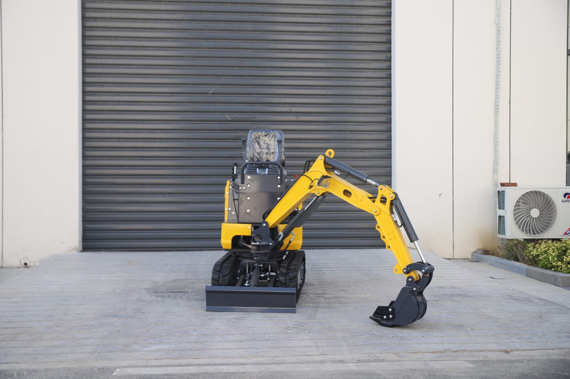 06Q mini excavator positioned for compact bucket digging work