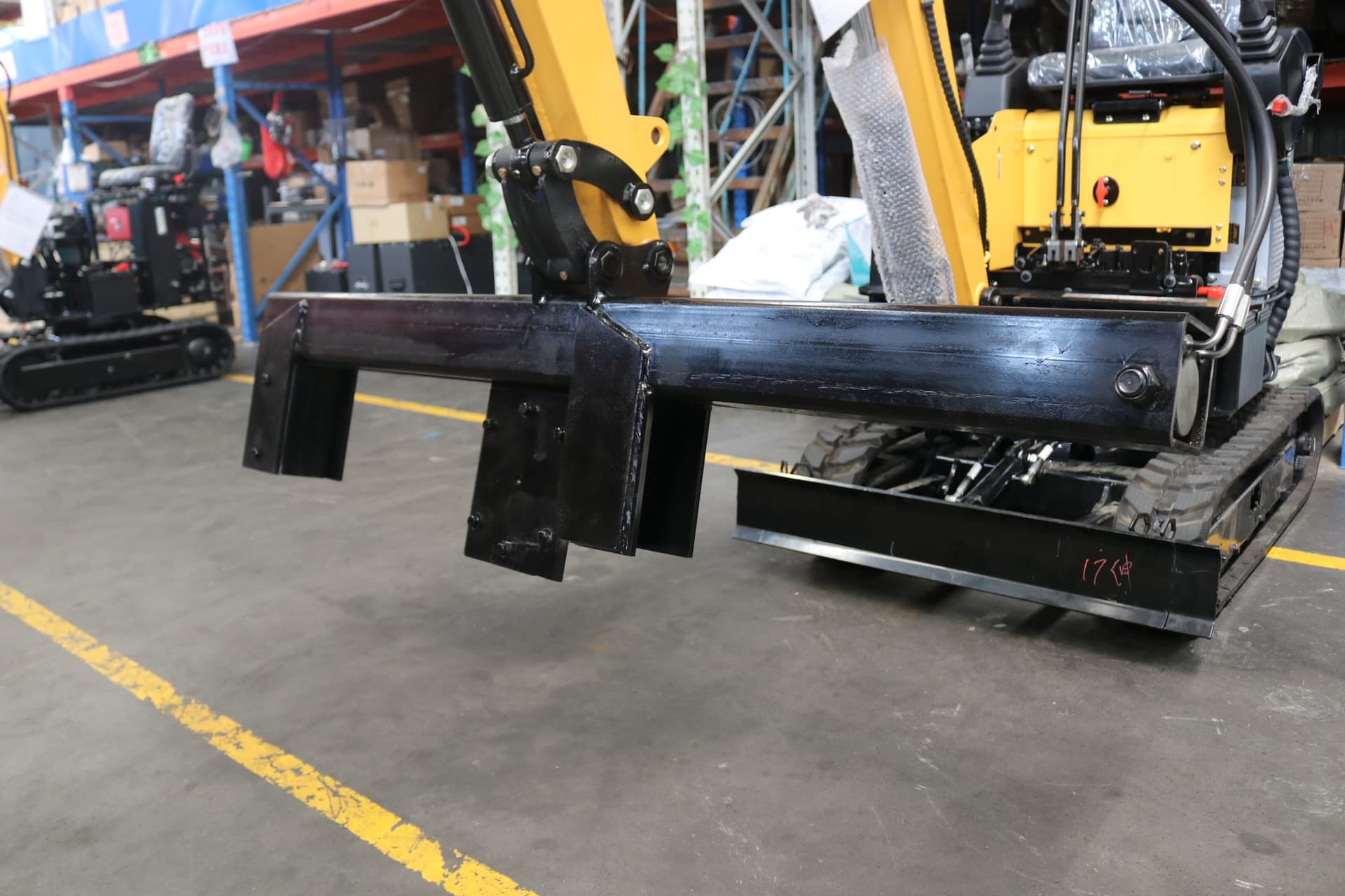 Log splitter mounted on compact excavator