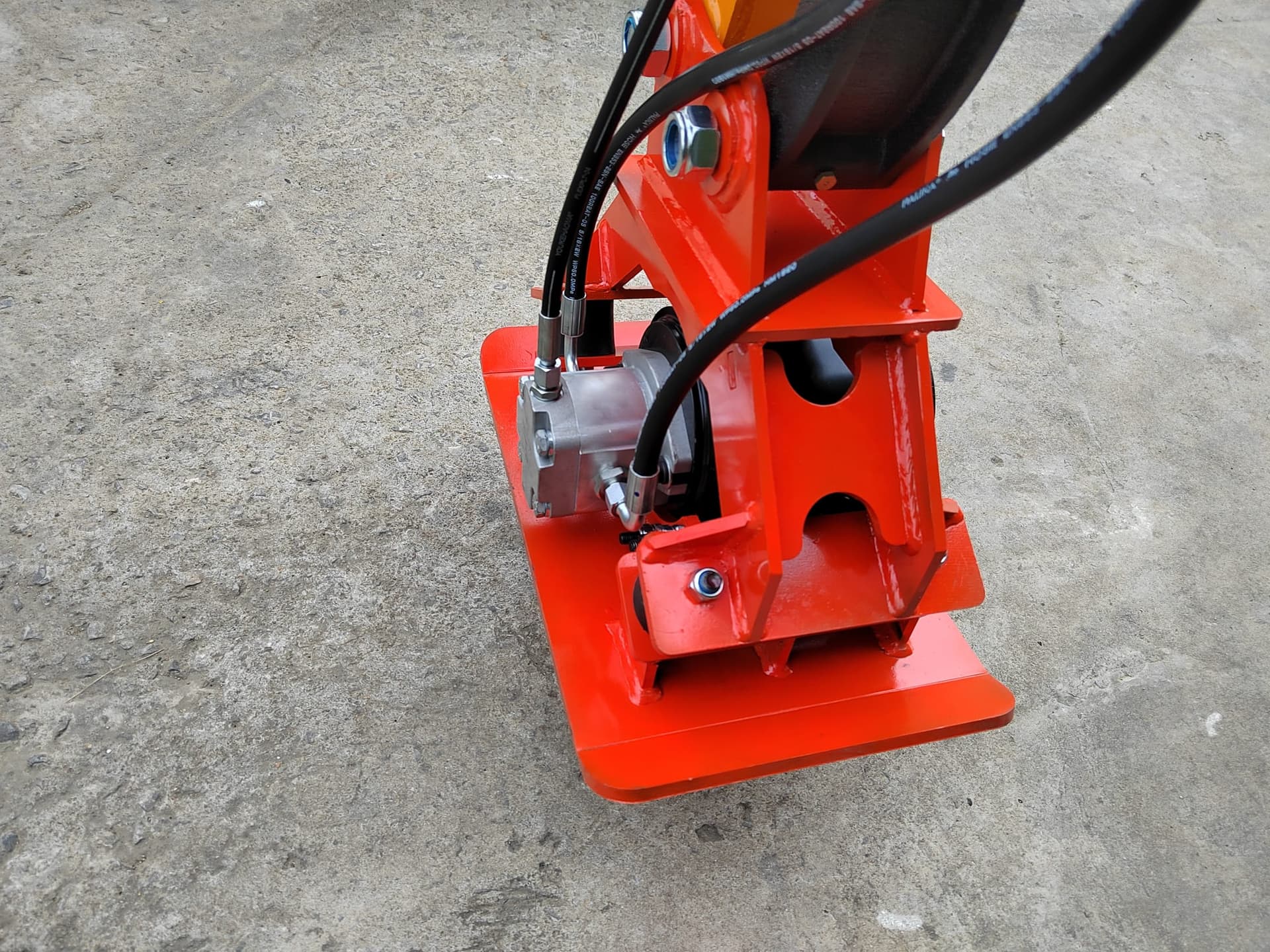 Plate compactor attachment for trench backfill work