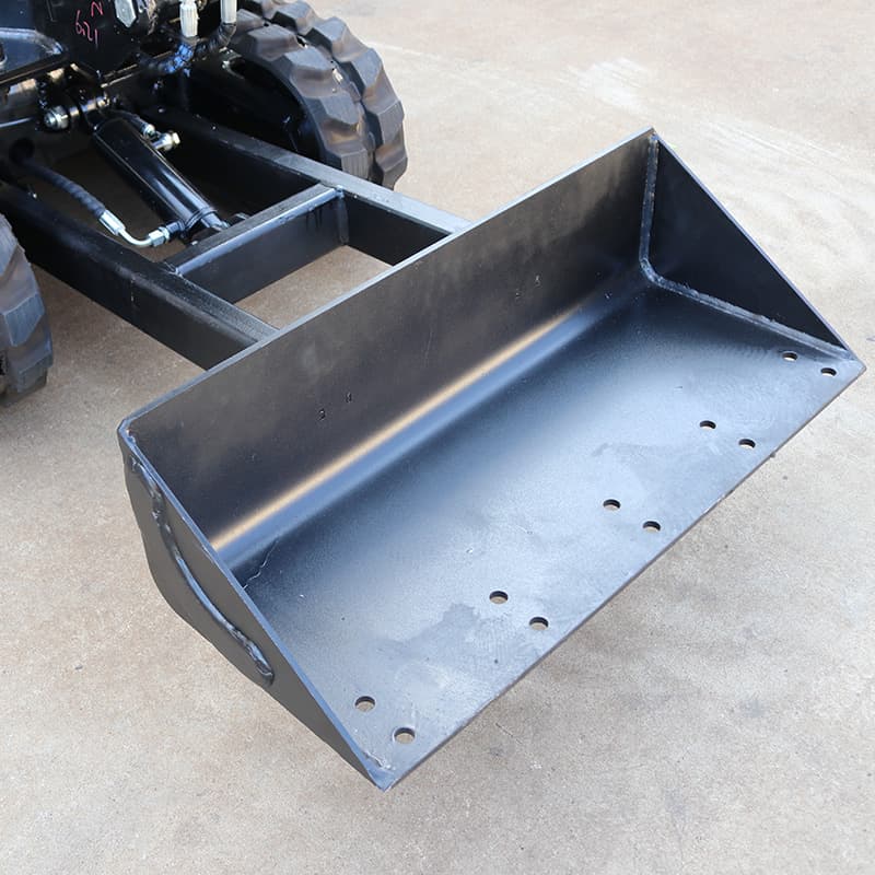 Snow plow attachment mounted on compact excavator