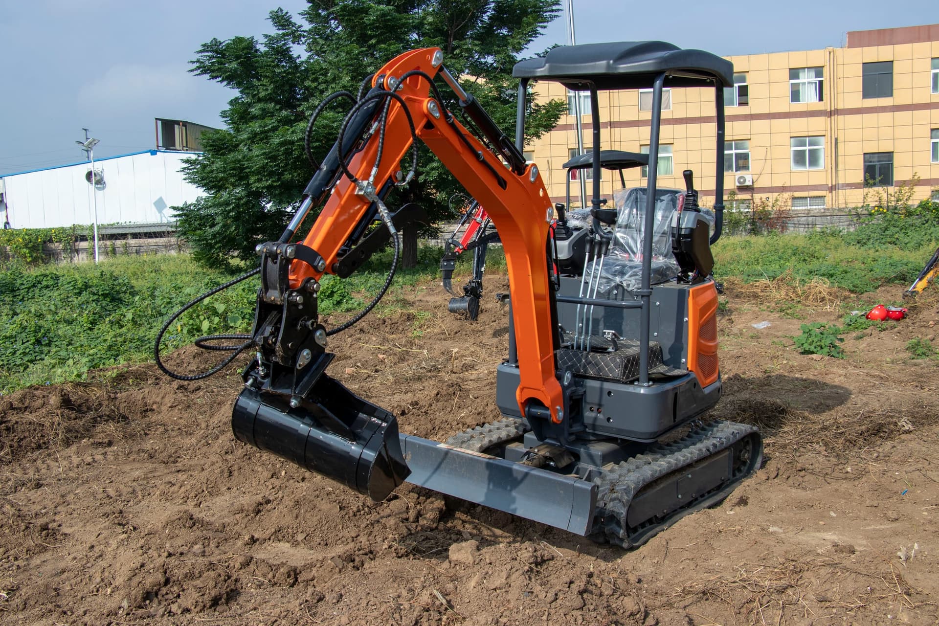 Tilt bucket grading with compact excavator
