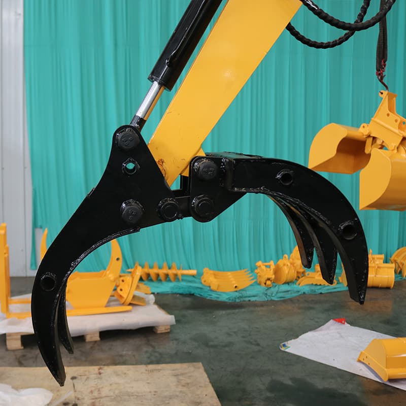 Timber grapple handling wood material with compact excavator