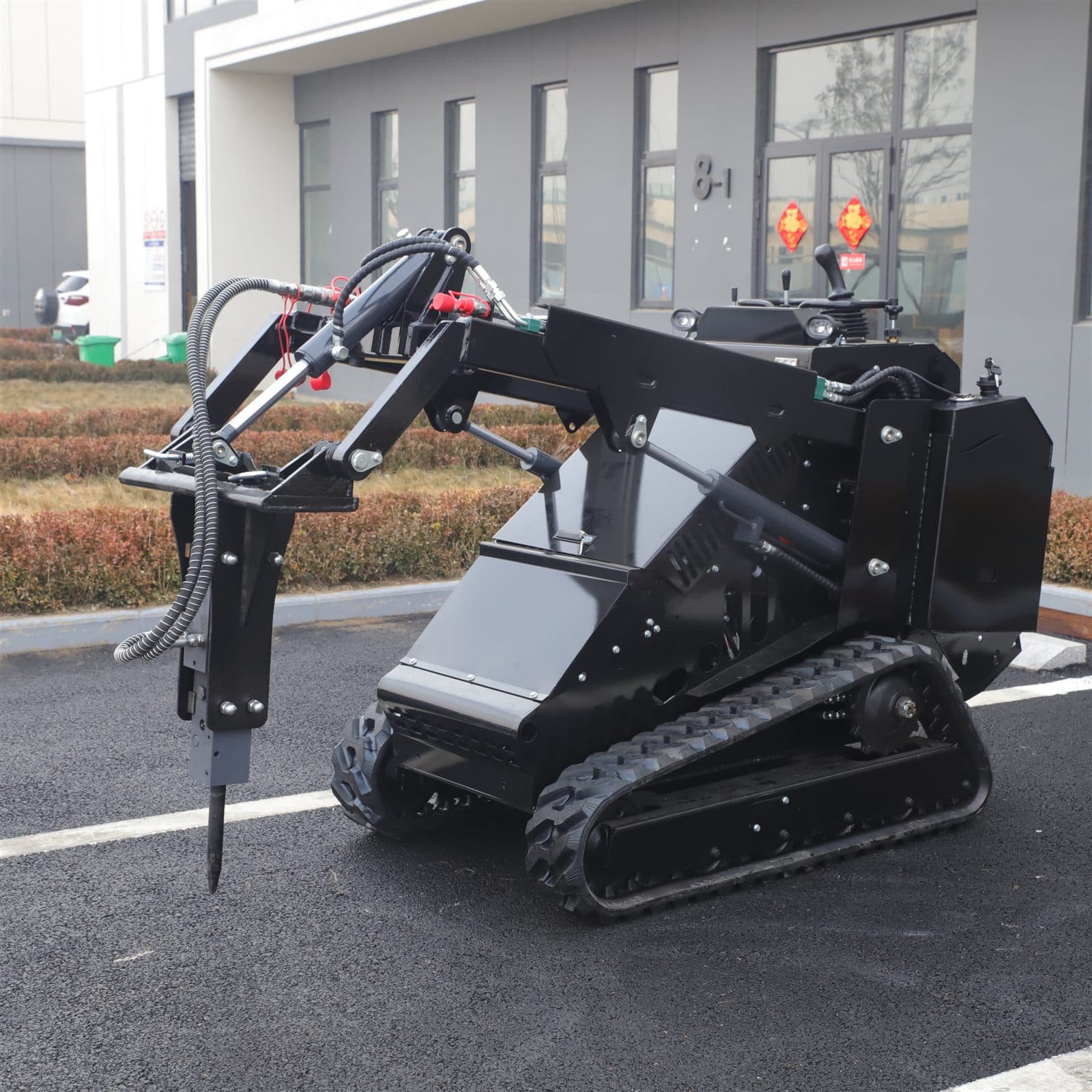 Hydraulic breaker attachment for skid steer loader
